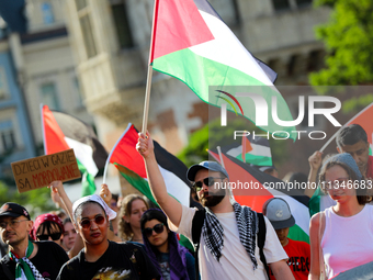 People are participating in a solidarity protest with Palestine in Krakow, Poland, on June 20, 2024, and are marching from the Main Square t...