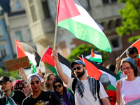 People are participating in a solidarity protest with Palestine in Krakow, Poland, on June 20, 2024, and are marching from the Main Square t...