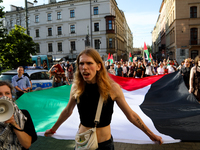 People are participating in a solidarity protest with Palestine in Krakow, Poland, on June 20, 2024, and are marching from the Main Square t...