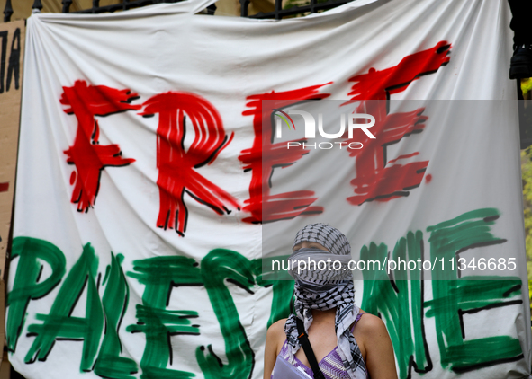 People are participating in a solidarity protest with Palestine in Krakow, Poland, on June 20, 2024, and are marching from the Main Square t...