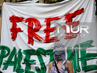 People are participating in a solidarity protest with Palestine in Krakow, Poland, on June 20, 2024, and are marching from the Main Square t...