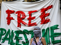 People are participating in a solidarity protest with Palestine in Krakow, Poland, on June 20, 2024, and are marching from the Main Square t...