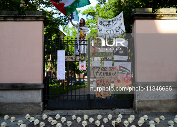 People are participating in a solidarity protest with Palestine in Krakow, Poland, on June 20, 2024, and are marching from the Main Square t...