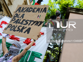 People are participating in a solidarity protest with Palestine in Krakow, Poland, on June 20, 2024, and are marching from the Main Square t...