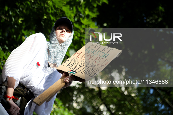 People are participating in a solidarity protest with Palestine in Krakow, Poland, on June 20, 2024, and are marching from the Main Square t...