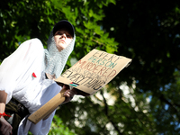 People are participating in a solidarity protest with Palestine in Krakow, Poland, on June 20, 2024, and are marching from the Main Square t...