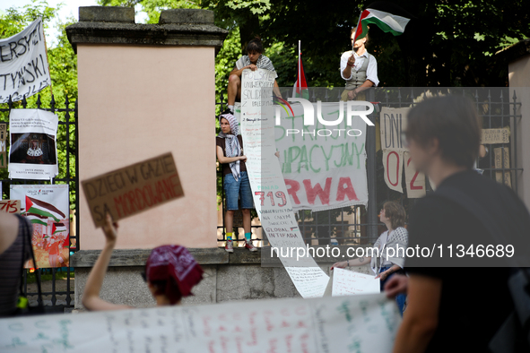 People are participating in a solidarity protest with Palestine in Krakow, Poland, on June 20, 2024, and are marching from the Main Square t...