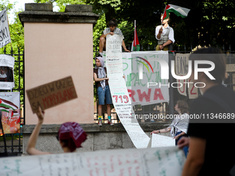 People are participating in a solidarity protest with Palestine in Krakow, Poland, on June 20, 2024, and are marching from the Main Square t...