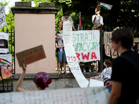 People are participating in a solidarity protest with Palestine in Krakow, Poland, on June 20, 2024, and are marching from the Main Square t...