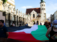 People are participating in a solidarity protest with Palestine in Krakow, Poland, on June 20, 2024, and are marching from the Main Square t...