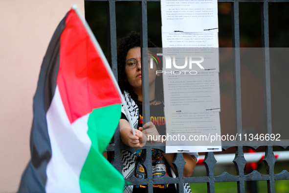 People are participating in a solidarity protest with Palestine in Krakow, Poland, on June 20, 2024, and are marching from the Main Square t...