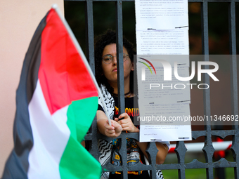 People are participating in a solidarity protest with Palestine in Krakow, Poland, on June 20, 2024, and are marching from the Main Square t...