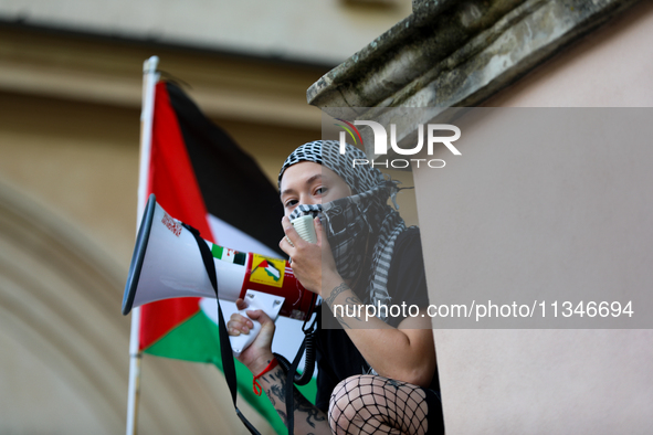 People are participating in a solidarity protest with Palestine in Krakow, Poland, on June 20, 2024, and are marching from the Main Square t...