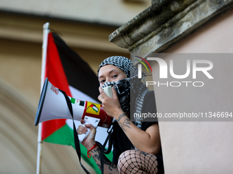 People are participating in a solidarity protest with Palestine in Krakow, Poland, on June 20, 2024, and are marching from the Main Square t...