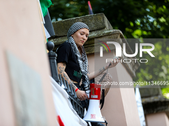 People are participating in a solidarity protest with Palestine in Krakow, Poland, on June 20, 2024, and are marching from the Main Square t...