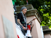 People are participating in a solidarity protest with Palestine in Krakow, Poland, on June 20, 2024, and are marching from the Main Square t...