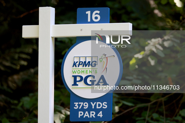 The yardage sign for the 16th tee is displayed during the first round of the KPMG Women's PGA Championship at Sahalee Country Club on Thursd...