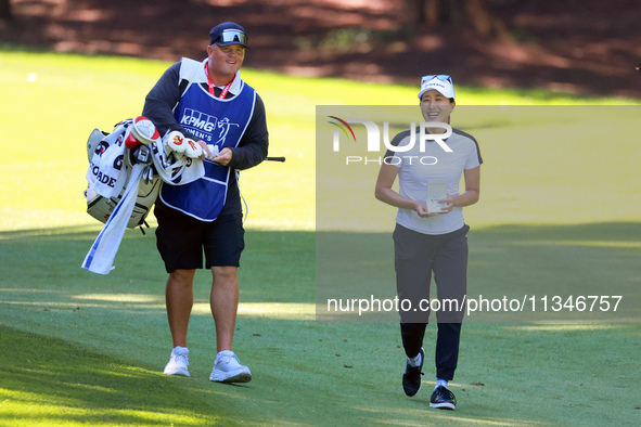 Jennifer Song of Orlando, Florida walks with her caddie on the 15th fairway during the first round of the KPMG Women's PGA Championship at S...