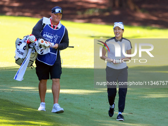 Jennifer Song of Orlando, Florida walks with her caddie on the 15th fairway during the first round of the KPMG Women's PGA Championship at S...