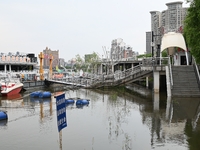 Part of the pedestrian walkway is being submerged by the rising waters of the Sandao pier along the Songhua River in Jilin City, Jilin provi...