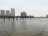 Part of the pedestrian walkway is being submerged by the rising waters of the Sandao pier along the Songhua River in Jilin City, Jilin provi...