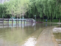 Part of the pedestrian walkway is being submerged by the rising waters of the Sandao pier along the Songhua River in Jilin City, Jilin provi...