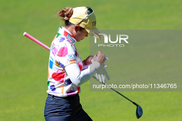 Pornanong Phatlum of Thailand makes notes as she walks on the 15th fairway during the first round of the KPMG Women's PGA Championship at Sa...