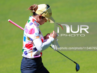 Pornanong Phatlum of Thailand makes notes as she walks on the 15th fairway during the first round of the KPMG Women's PGA Championship at Sa...