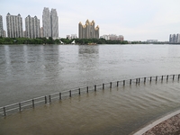 Part of the pedestrian walkway is being submerged by the rising waters of the Sandao pier along the Songhua River in Jilin City, Jilin provi...