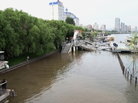 Part of the pedestrian walkway is being submerged by the rising waters of the Sandao pier along the Songhua River in Jilin City, Jilin provi...