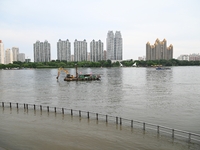 Part of the pedestrian walkway is being submerged by the rising waters of the Sandao pier along the Songhua River in Jilin City, Jilin provi...