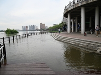 Part of the pedestrian walkway is being submerged by the rising waters of the Sandao pier along the Songhua River in Jilin City, Jilin provi...