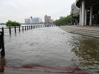 Part of the pedestrian walkway is being submerged by the rising waters of the Sandao pier along the Songhua River in Jilin City, Jilin provi...