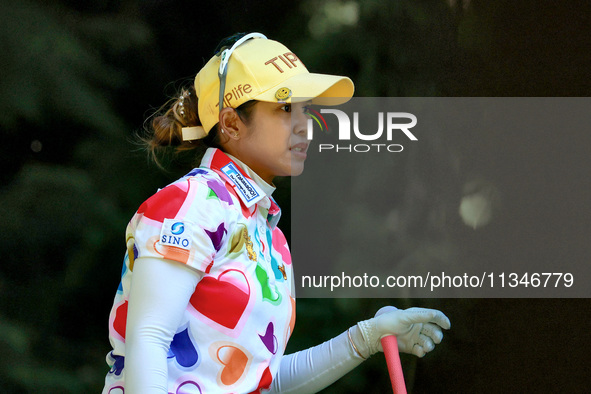 Pornanong Phatlum of Thailand follows her shot from the 16th tee during the first round of the KPMG Women's PGA Championship at Sahalee Coun...