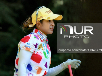 Pornanong Phatlum of Thailand follows her shot from the 16th tee during the first round of the KPMG Women's PGA Championship at Sahalee Coun...