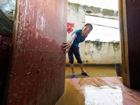 Villagers are cleaning up silt at Changjing Village in Qiukou, Wuyuan county, Shangrao city, East China's Jiangxi province, on June 20, 2024...