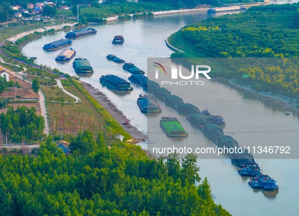 HUAI'AN, CHINA, on June 20, 2024, an aerial photo is showing a large number of ships waiting to be locked upstream of Huaian Lock on the Nor...