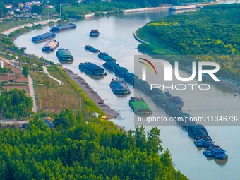 HUAI'AN, CHINA, on June 20, 2024, an aerial photo is showing a large number of ships waiting to be locked upstream of Huaian Lock on the Nor...