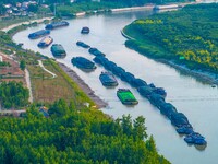 HUAI'AN, CHINA, on June 20, 2024, an aerial photo is showing a large number of ships waiting to be locked upstream of Huaian Lock on the Nor...