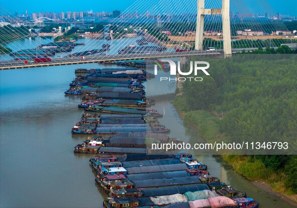 HUAI'AN, CHINA, on June 20, 2024, an aerial photo is showing a large number of ships waiting to be locked upstream of Huaian Lock on the Nor...