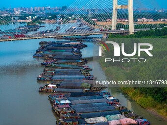 HUAI'AN, CHINA, on June 20, 2024, an aerial photo is showing a large number of ships waiting to be locked upstream of Huaian Lock on the Nor...