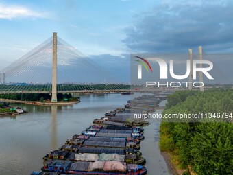 HUAI'AN, CHINA, on June 20, 2024, an aerial photo is showing a large number of ships waiting to be locked upstream of Huaian Lock on the Nor...