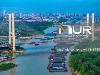 HUAI'AN, CHINA, on June 20, 2024, an aerial photo is showing a large number of ships waiting to be locked upstream of Huaian Lock on the Nor...