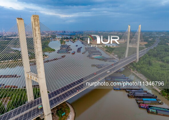 HUAI'AN, CHINA, on June 20, 2024, an aerial photo is showing a large number of ships waiting to be locked upstream of Huaian Lock on the Nor...