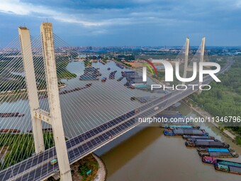 HUAI'AN, CHINA, on June 20, 2024, an aerial photo is showing a large number of ships waiting to be locked upstream of Huaian Lock on the Nor...