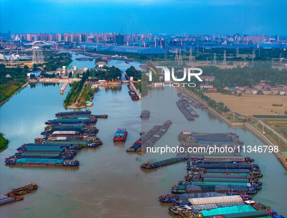 HUAI'AN, CHINA, on June 20, 2024, an aerial photo is showing a large number of ships waiting to be locked upstream of Huaian Lock on the Nor...