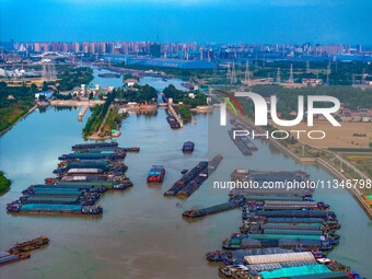 HUAI'AN, CHINA, on June 20, 2024, an aerial photo is showing a large number of ships waiting to be locked upstream of Huaian Lock on the Nor...