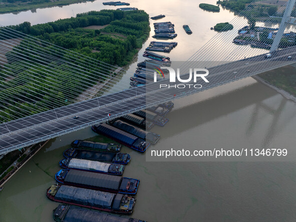 HUAI'AN, CHINA, on June 20, 2024, an aerial photo is showing a large number of ships waiting to be locked upstream of Huaian Lock on the Nor...