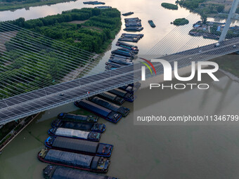 HUAI'AN, CHINA, on June 20, 2024, an aerial photo is showing a large number of ships waiting to be locked upstream of Huaian Lock on the Nor...