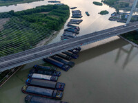 HUAI'AN, CHINA, on June 20, 2024, an aerial photo is showing a large number of ships waiting to be locked upstream of Huaian Lock on the Nor...